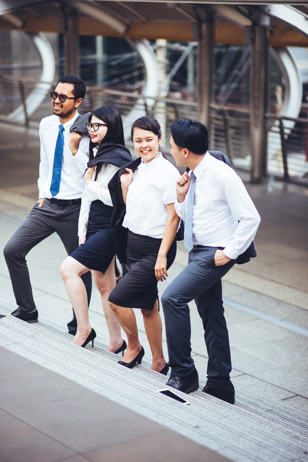 colleagues-walking-steps-city